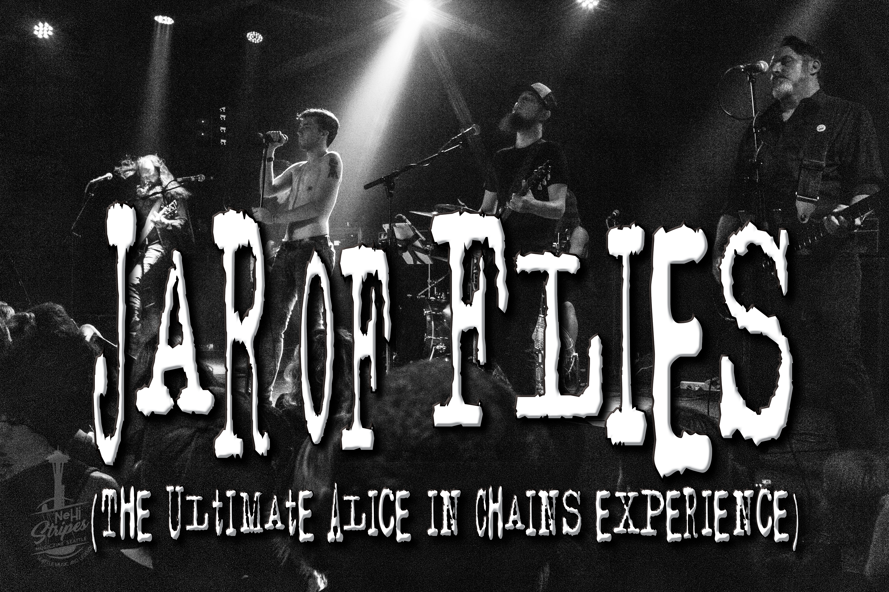 A band is performing on stage with the words fear of flies written above them.